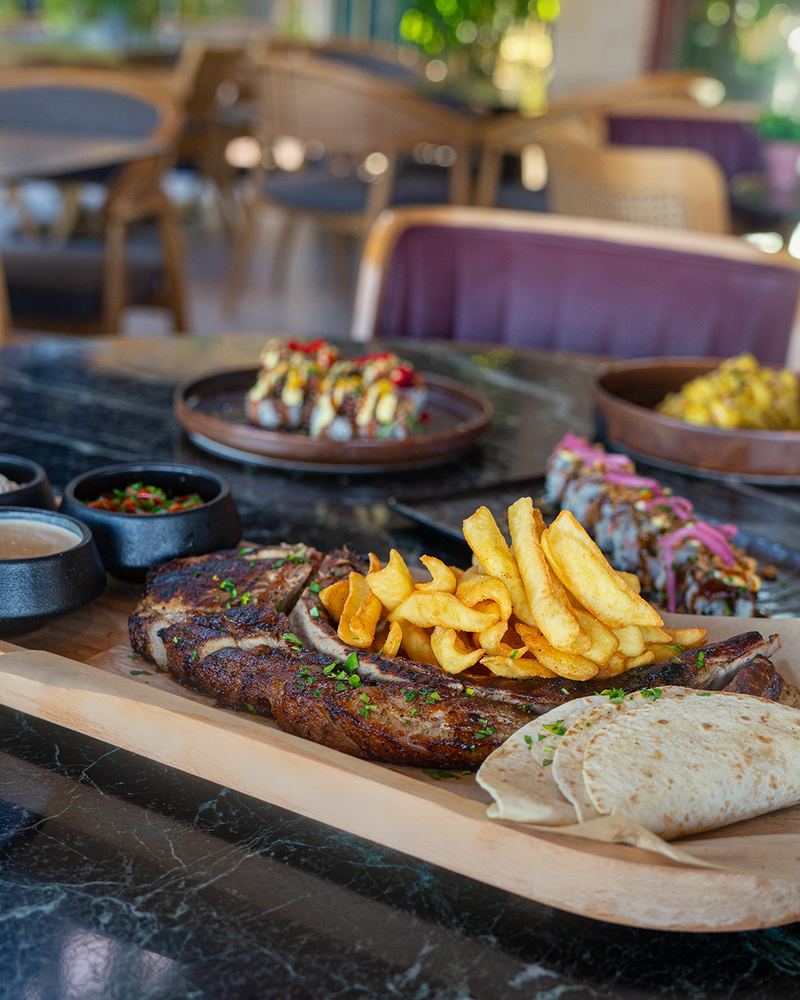 Grilled pork steak served with fries and demi-glace